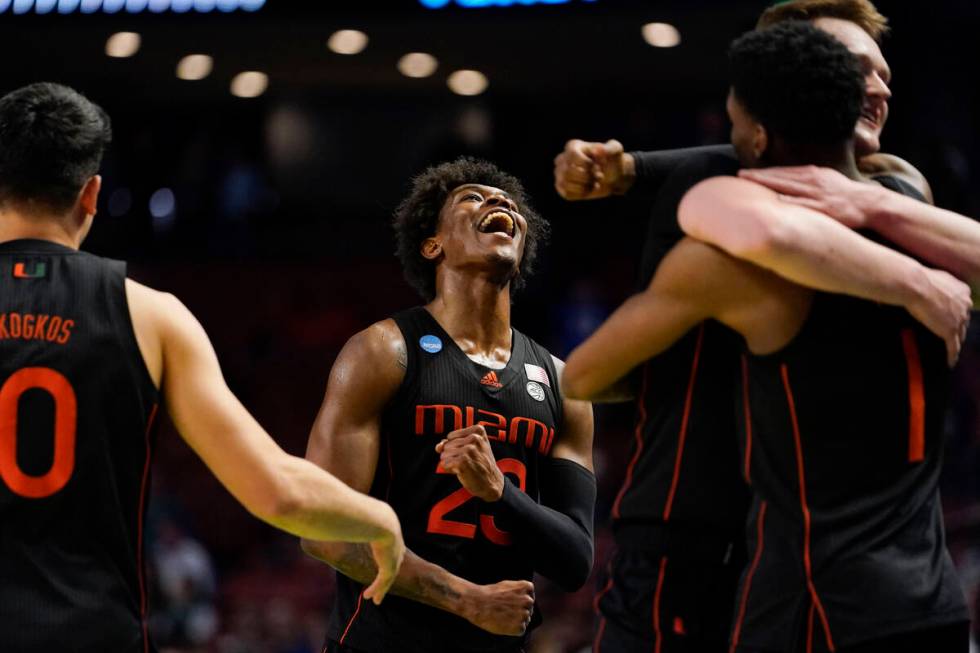 Miami's Kameron McGusty (23) celebrates after a win over Auburn in a college basketball game in ...