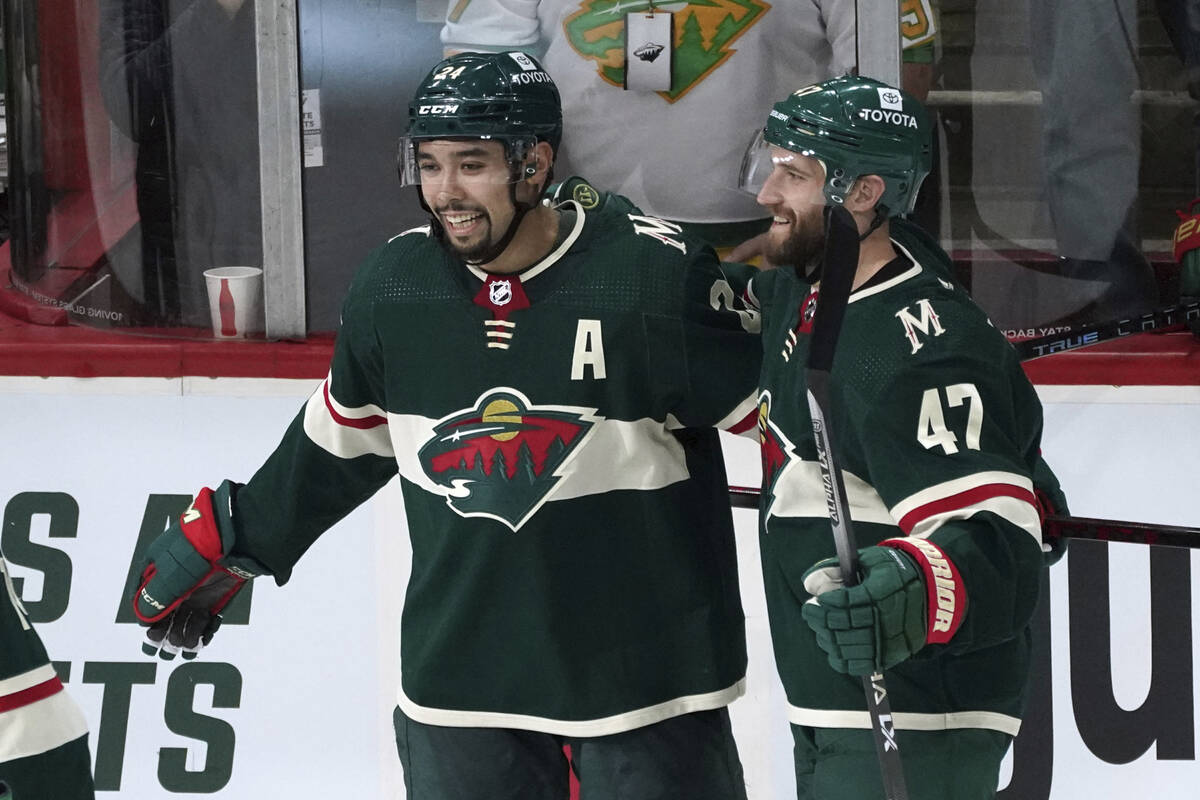 Minnesota Wild's Alex Goligoski (47) and Matt Dumba, left, celebrate Dumba's go-ahead goal in t ...