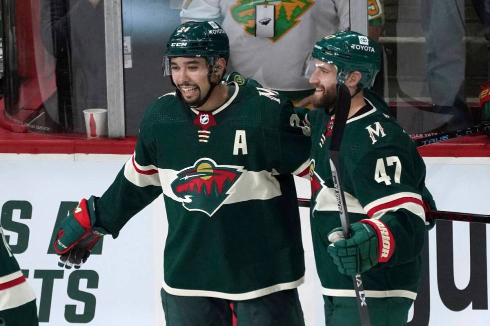 Minnesota Wild's Alex Goligoski (47) and Matt Dumba, left, celebrate Dumba's go-ahead goal in t ...