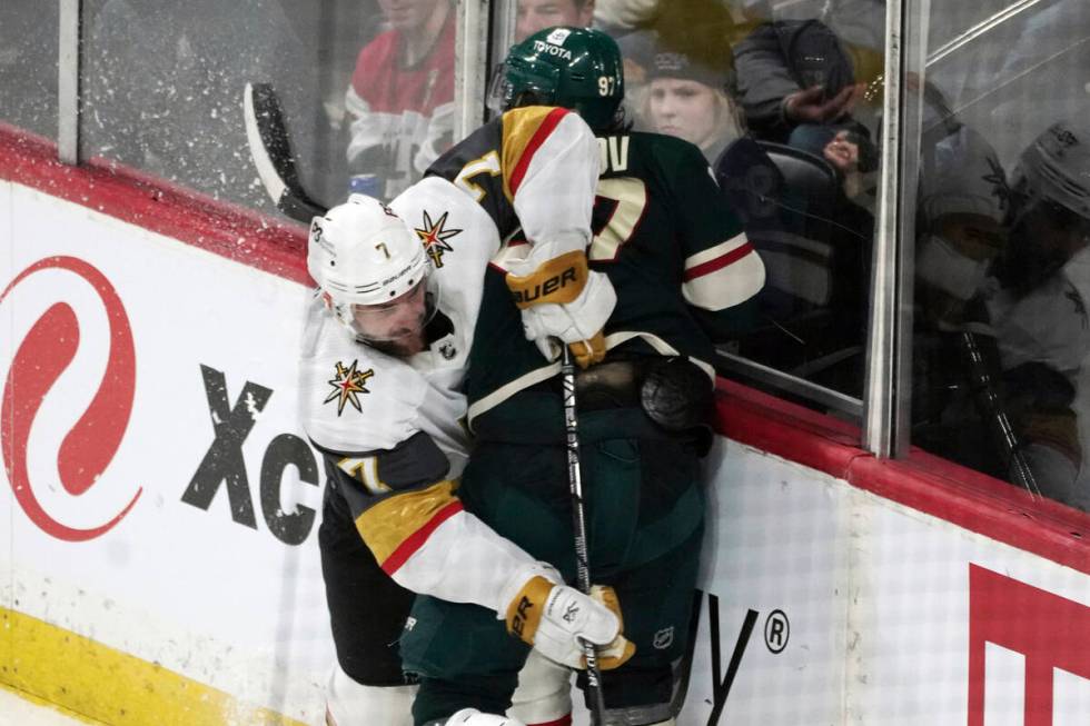 Vegas Golden Knights' Alex Pietrangelo (7) tries to get past Minnesota Wild's Kirill Kaprizov ( ...