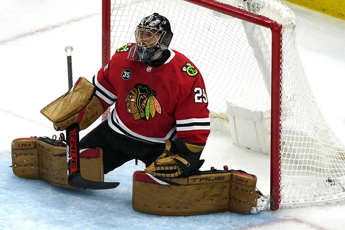 Chicago Blackhawks goaltender Marc-Andre Fleury reacts after Winnipeg Jets left wing Nikolaj Eh ...