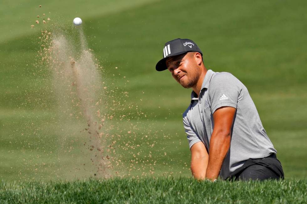 Xander Schauffele blasts from the sand trap on the fifth hole during the second round of the Va ...