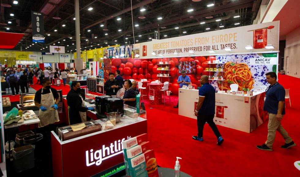 People explore the show floor during the International Pizza Expo at the Las Vegas Convention C ...