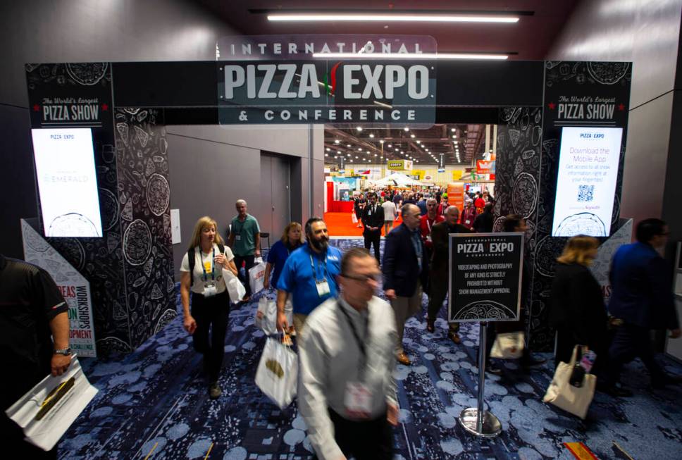 Attendees come and go during the International Pizza Expo at the Las Vegas Convention Center on ...