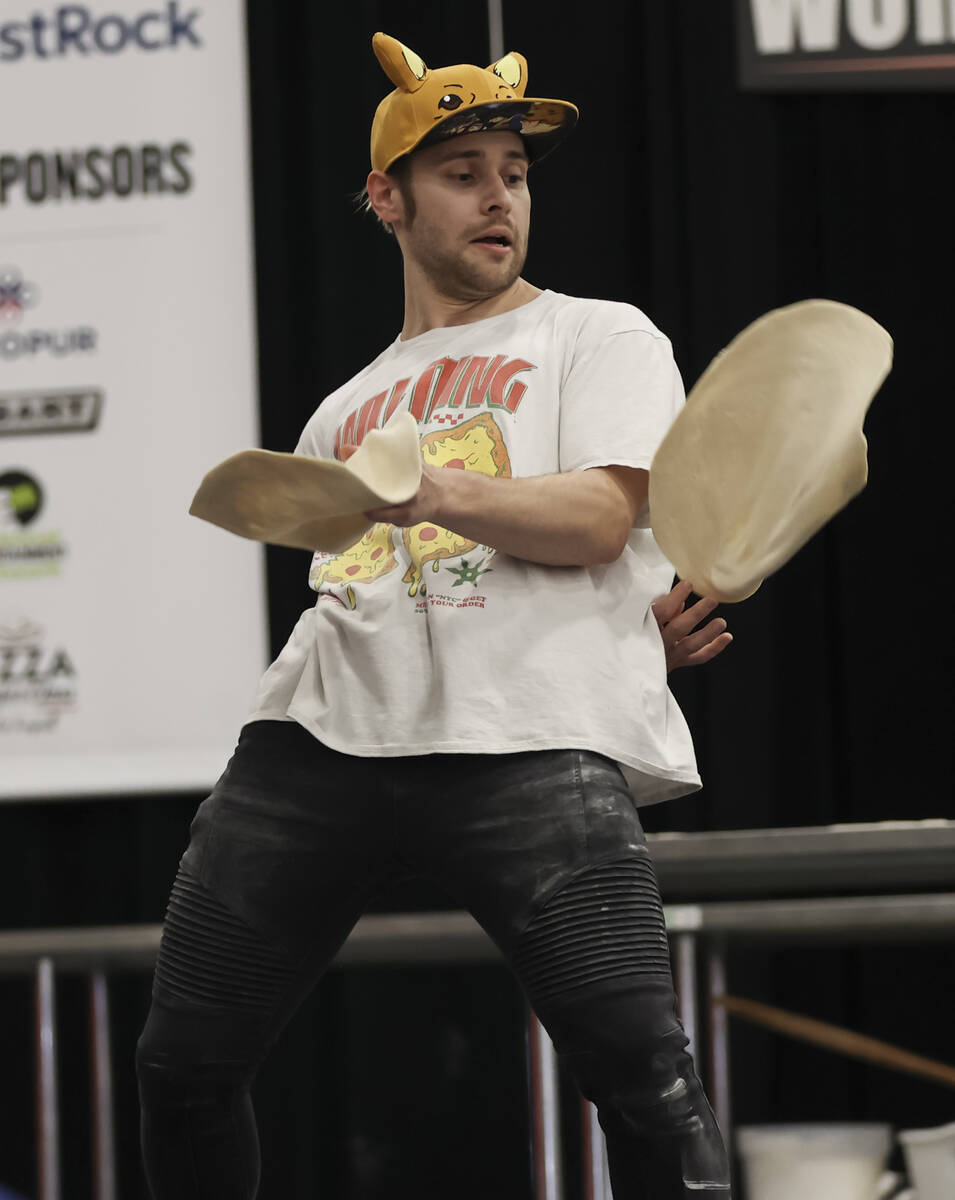 Nathan Wilson, of Bellefontaine, Ohio, competes in the freestyle acrobatic dough tossing compet ...