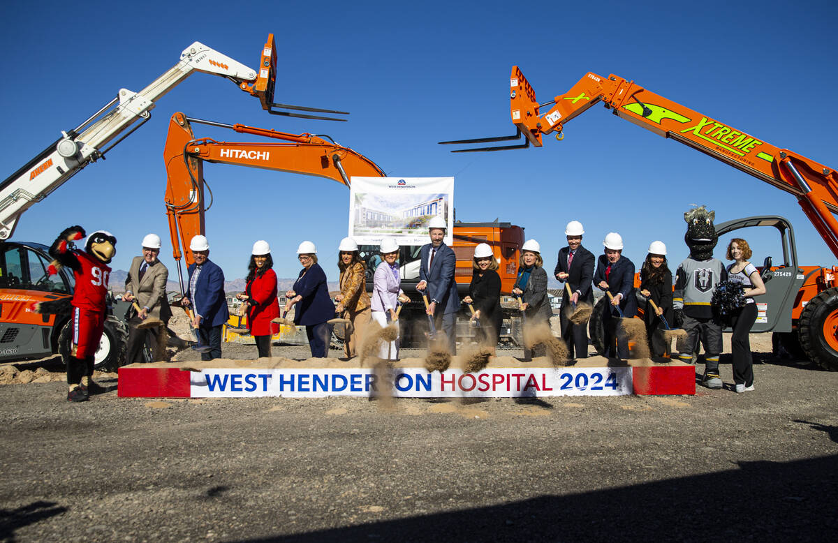 Officials and dignitaries pose while breaking ground on West Henderson Hospital on Wednesday, M ...