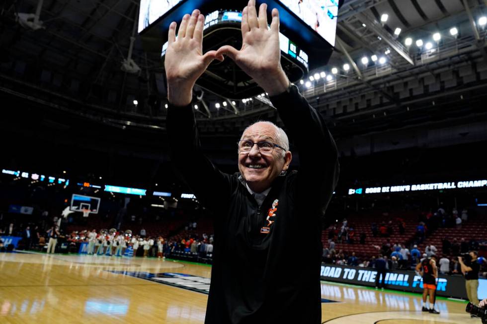Miami head coach Jim Larranaga cheers with fans after a win over Auburnin a college basketball ...