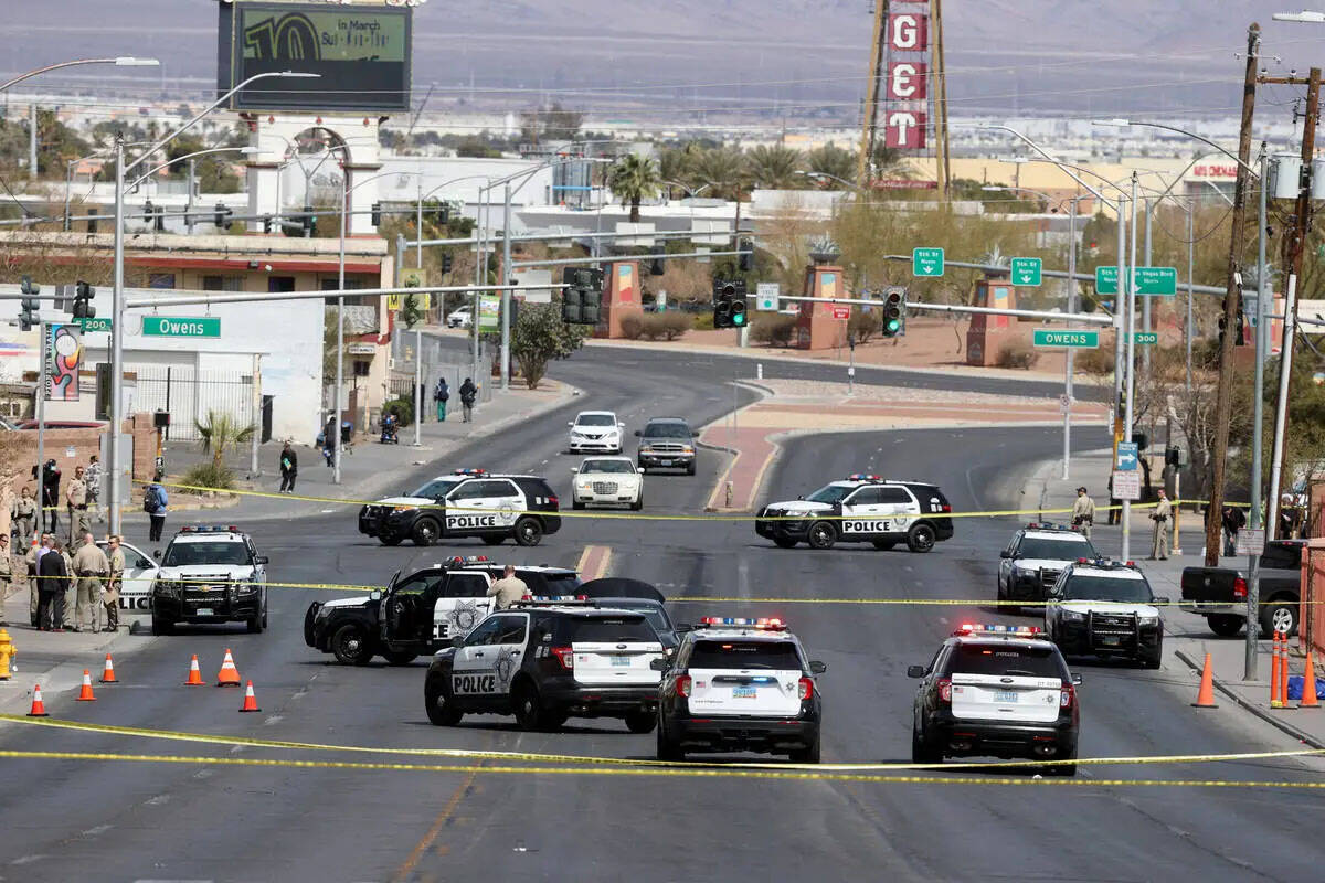 In this March 14, 2022, file photo, Las Vegas police investigate an officer-involved shooting o ...