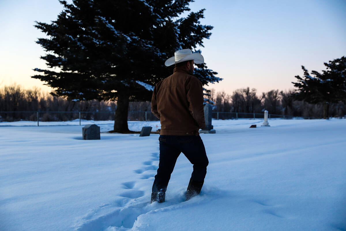 Josh Myers walks to the grave of Lauren Starcevich on Jan. 26, 2022 in Driggs, Idaho. (Rachel A ...