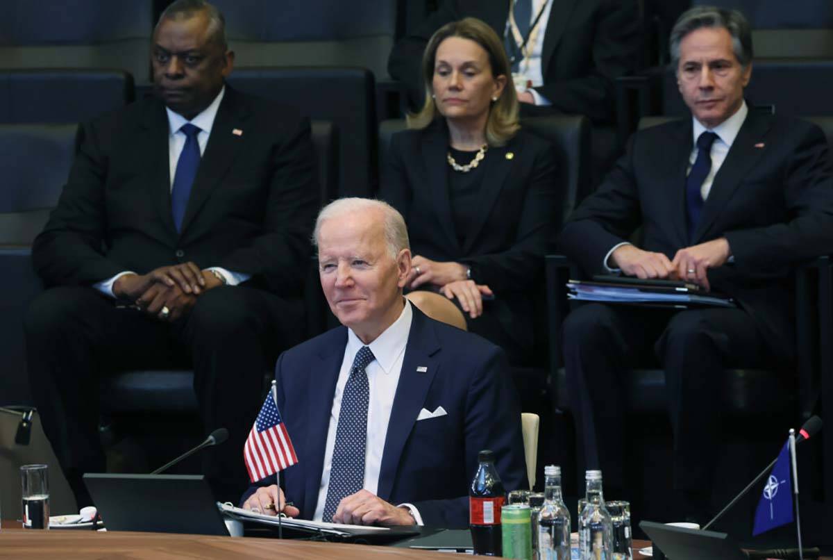 President Joe Biden attends a North Atlantic Council meeting during a NATO summit to discuss Ru ...