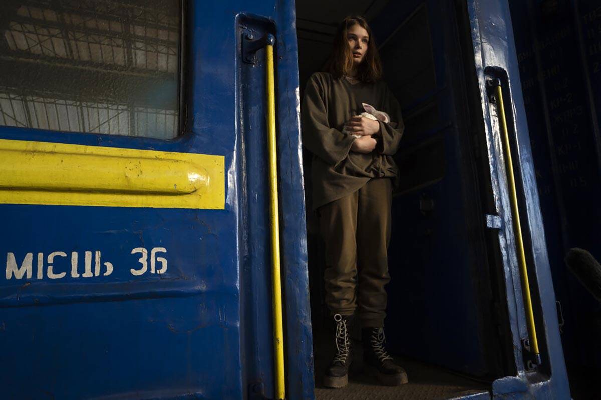 Julia, 16, from Dnipro, who is traveling alone, holds her pet rabbit Baby after arriving to the ...