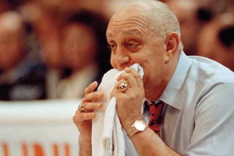 In this April 2, 1990, file photo, UNLV coach Jerry Tarkanian chews on his towel while watching ...