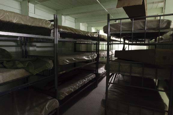 Bunks for 27 men are stacked three high in a bunker, at the Arden maintenance yard near Rainbow ...