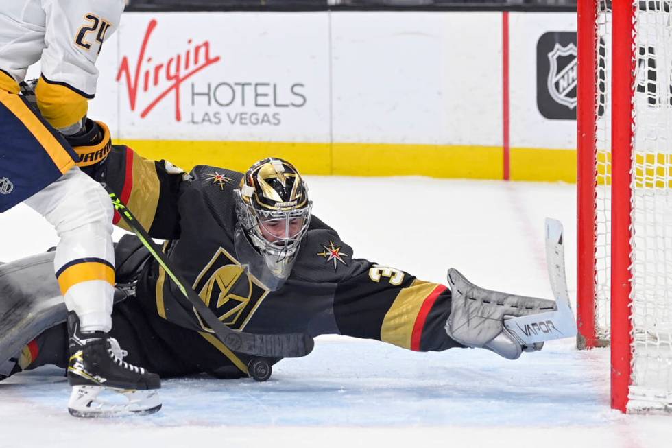 Vegas Golden Knights goaltender Logan Thompson (36) makes a save against the Nashville Predator ...