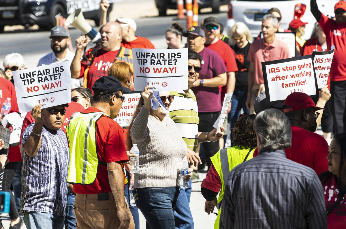 Hundreds of culinary and bartenders union members rally outside of the Foley Federal Building i ...
