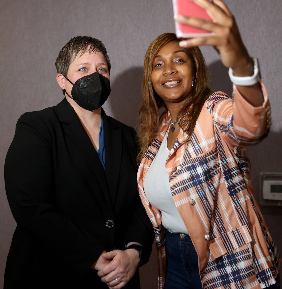 Clark County District Judge Tara Clark Newberry, right, visits with Jen Lewis during the Lambda ...