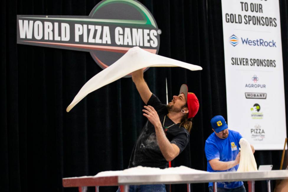Ben Shanks, of Prescott, Ariz.,competes in the largest dough stretch event during the Internati ...