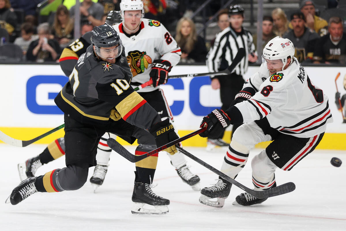 Vegas Golden Knights center Nicolas Roy (10) takes a shot at the goal under pressure from Chica ...