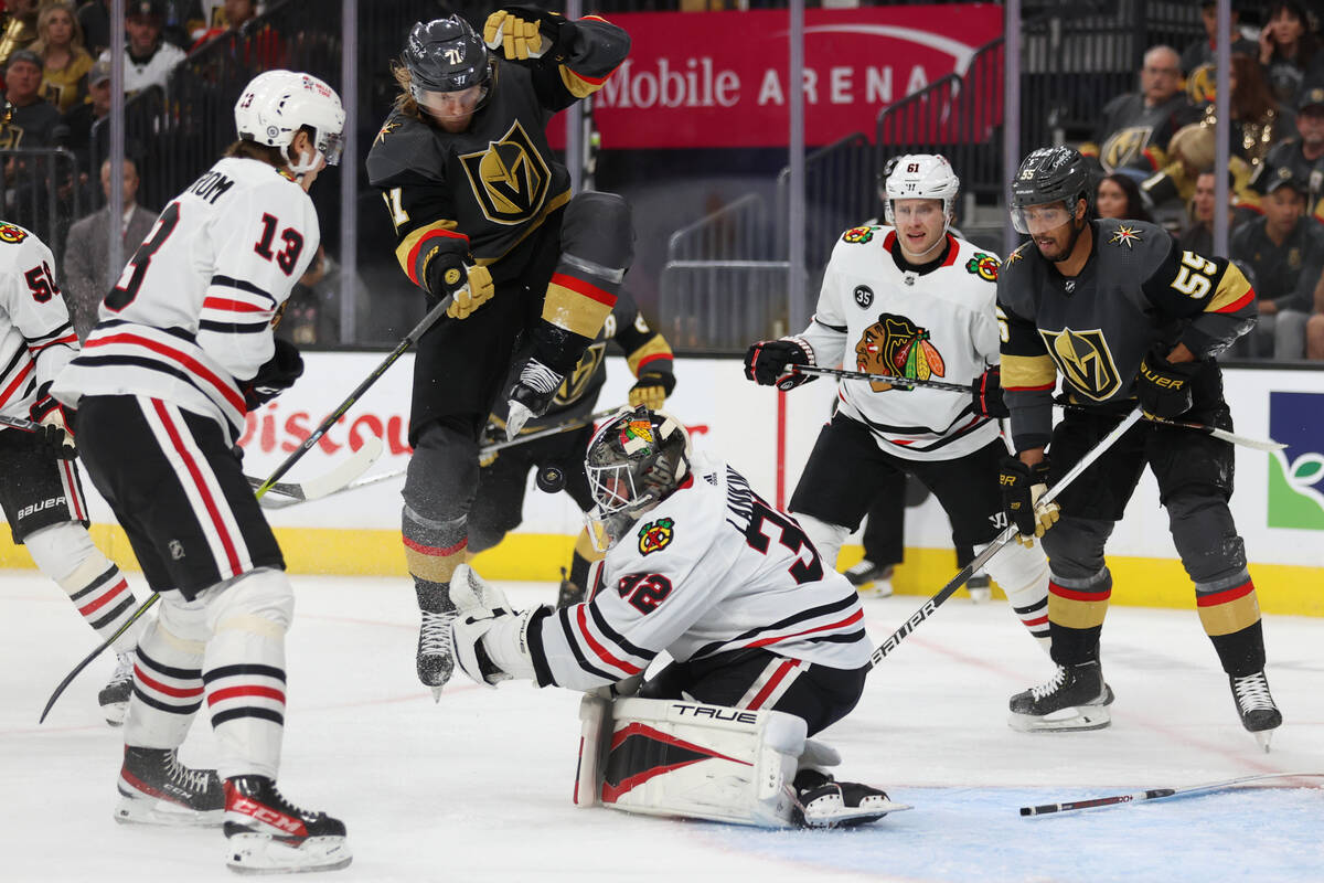 Vegas Golden Knights center William Karlsson (71) leaps over the puck as Chicago Blackhawks goa ...