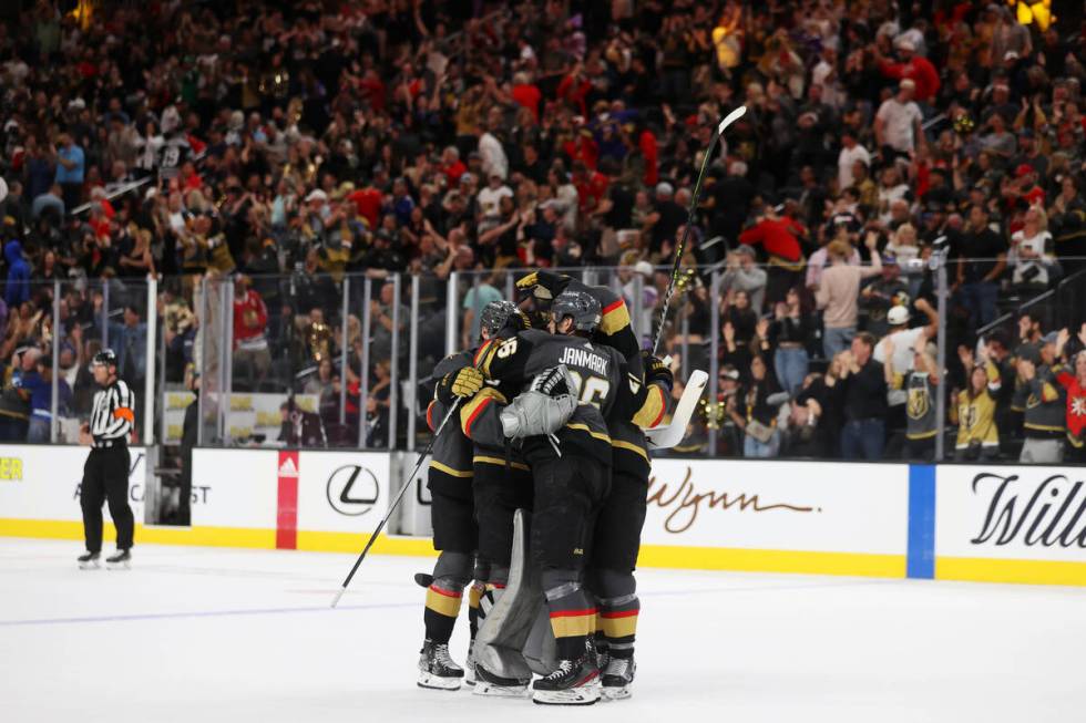 The Vegas Golden Knights celebrate their overtime win against the Chicago Blackhawks NHL hockey ...