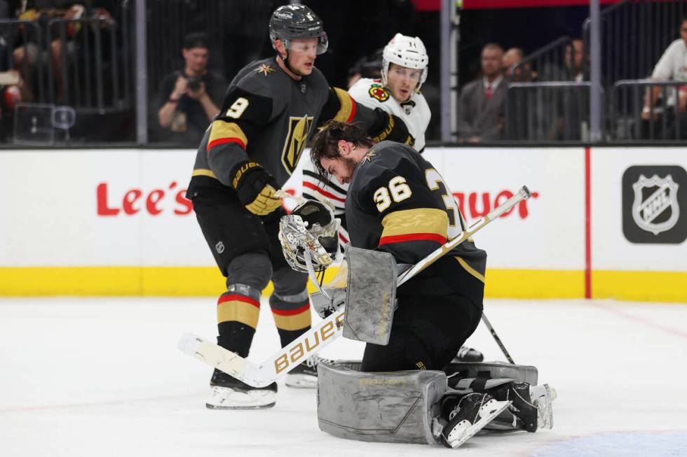 Vegas Golden Knights goaltender Logan Thompson (36) loses his helmet during the third period of ...