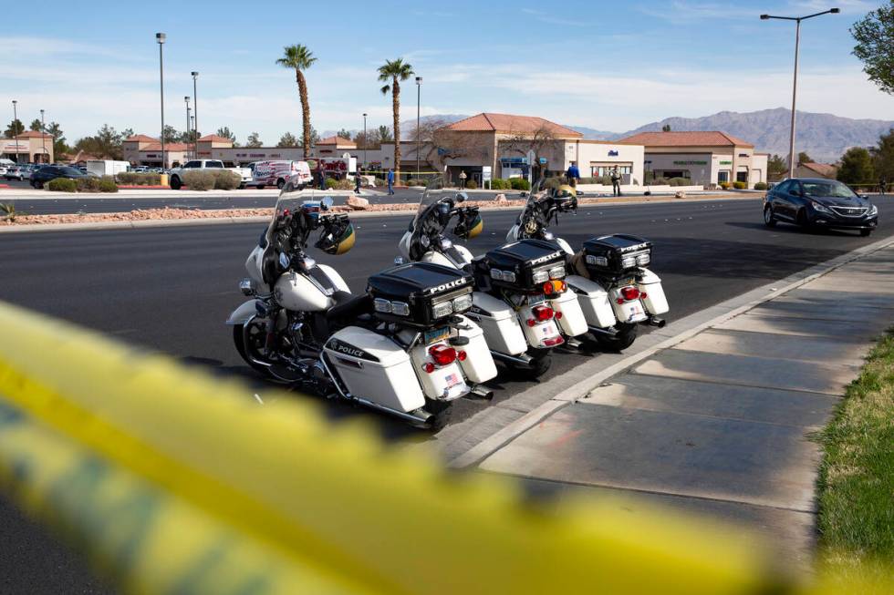 Las Vegas police attend to the scene where a motorcyclist died in a crash at the intersection o ...