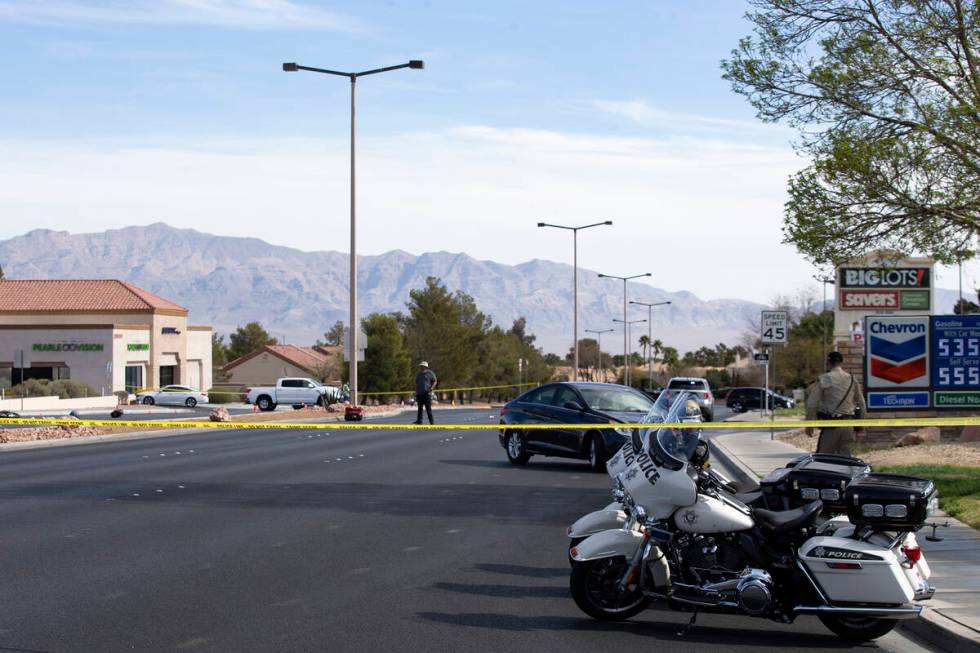 Las Vegas police attend to the scene where a motorcyclist died in a crash at the intersection o ...