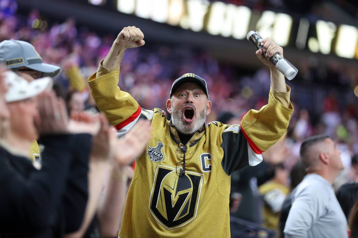 Fans celebrate after a Vegas Golden Knights goal during the third period of an NHL hockey game ...