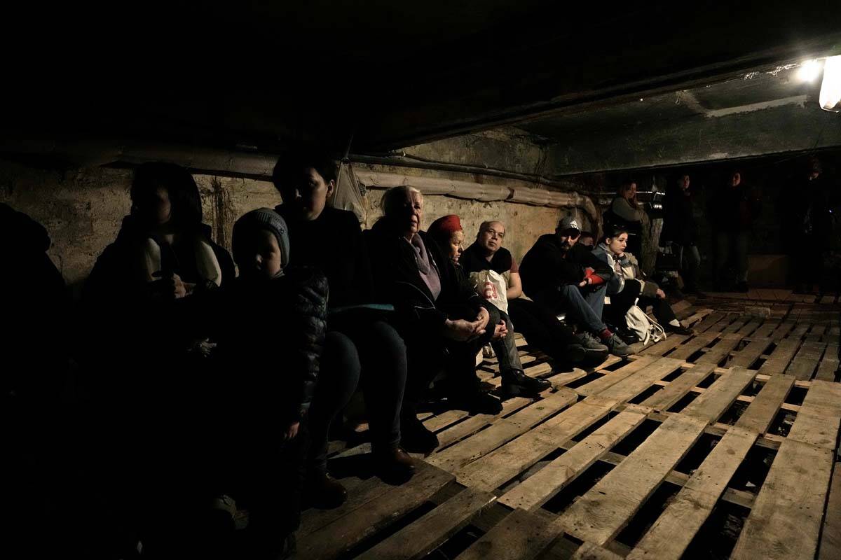 People shelter underground following explosions in Lviv, western Ukraine, Saturday, March 26, 2 ...