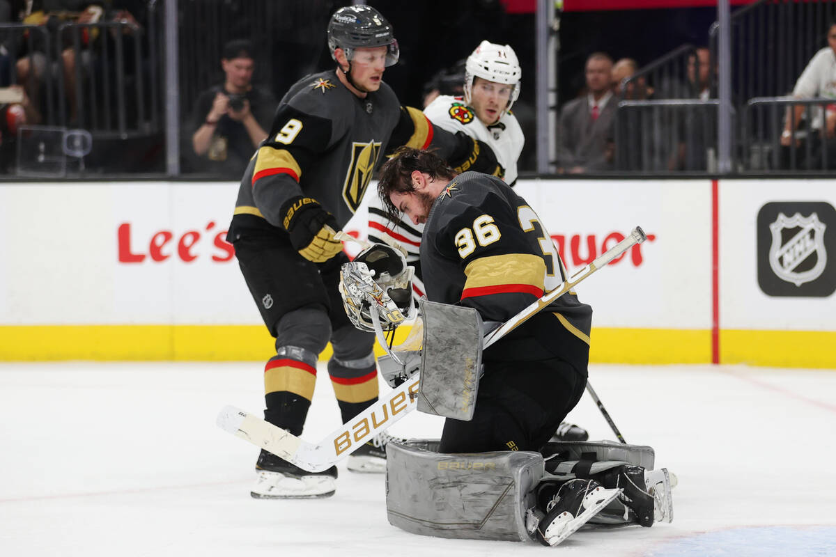 Vegas Golden Knights goaltender Logan Thompson (36) loses his helmet during the third period of ...