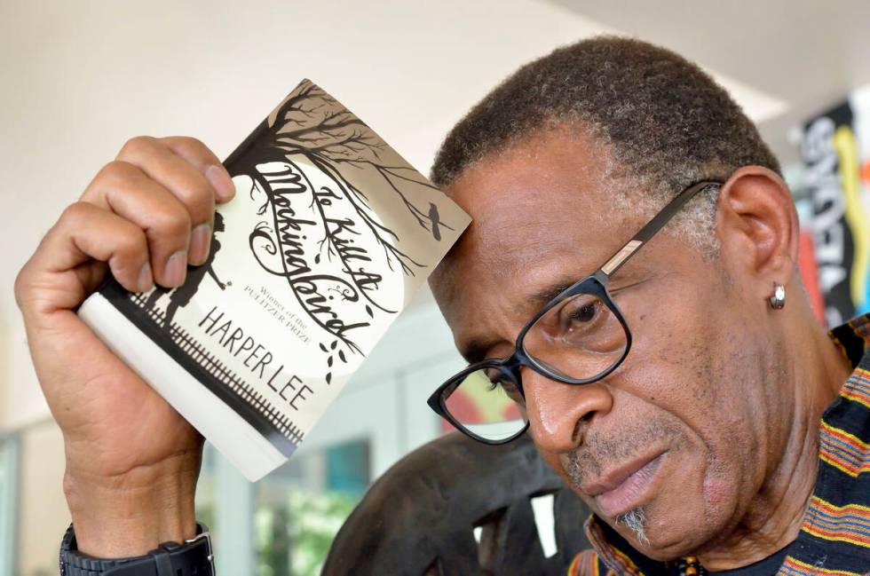 Actor and teacher Antonio Fargas is shown with a copy of Harper Lee's "To Kill a Mockingbird" a ...