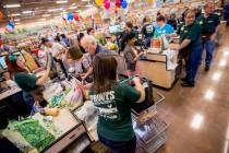 Employees check out customers at the grand opening of Sprouts Farmer's Market. (Las Vegas Revie ...