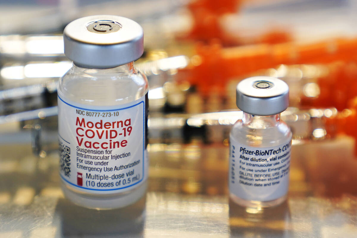 Vials for the Moderna and Pfizer COVID-19 vaccines are seen at a temporary clinic in Exeter, N. ...