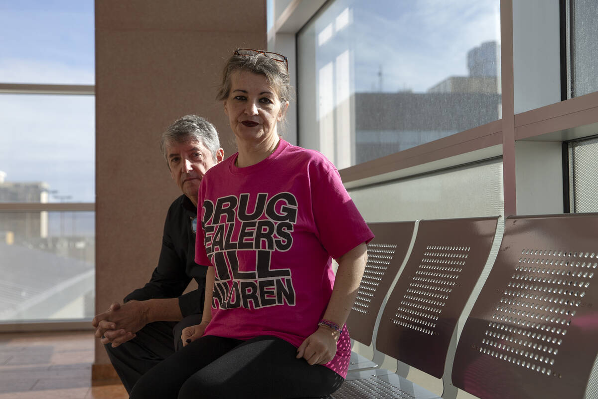 Tom and Mihaela Steyer wait outside of a hearing for Angelo Loza, who is charged with the murde ...