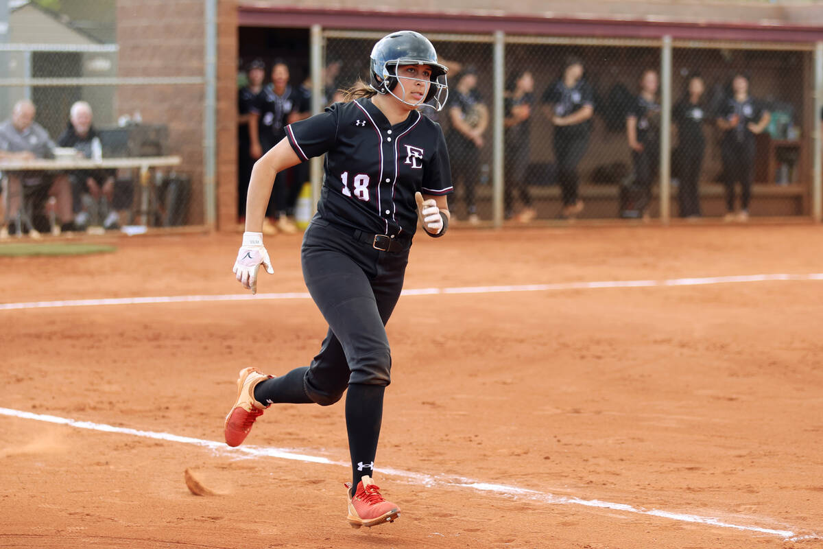 Faith Lutheran’s Samantha Schlaff (18) runs the bases for a double during a softball gam ...