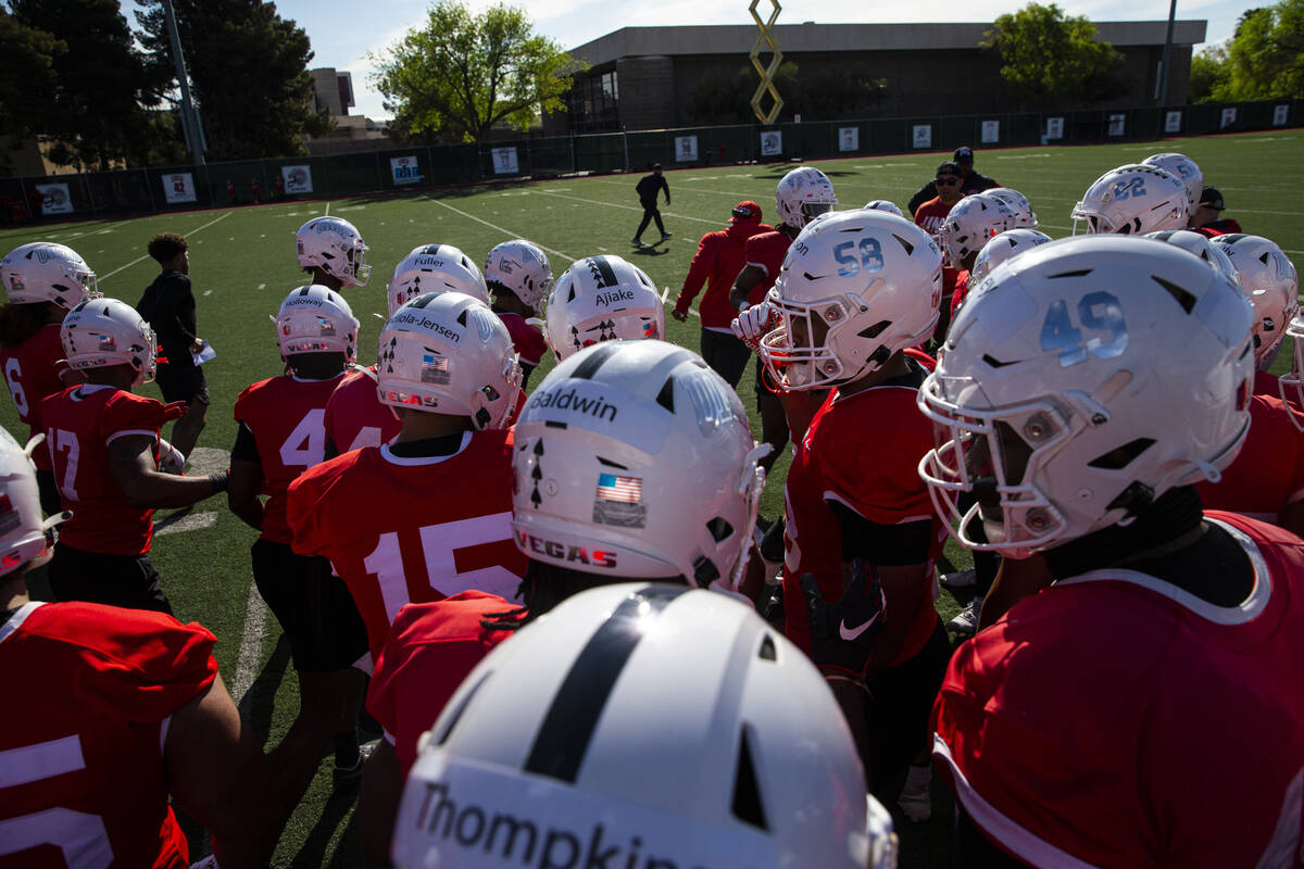 UNLV Rebels defensive players huddle during the first day of spring football practice on Tuesda ...