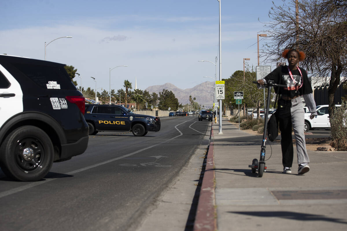 Police investigate a shooting at Western High School in Las Vegas, Tuesday, March 29, 2022. (Er ...