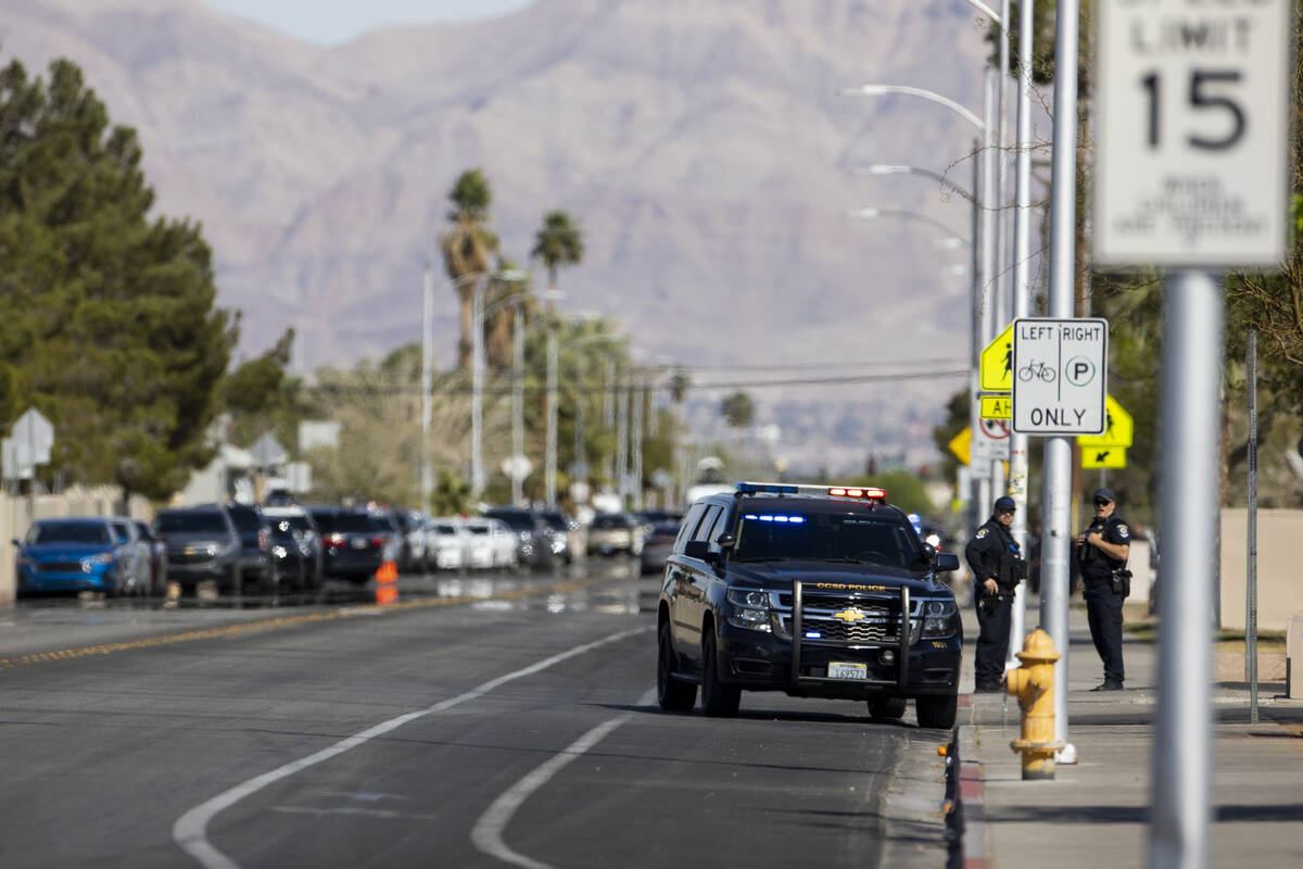 Police investigate a shooting at Western High School in Las Vegas, Tuesday, March 29, 2022. (Er ...