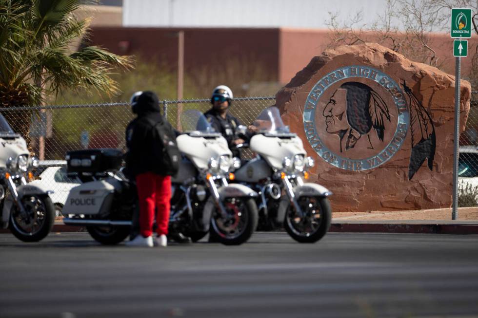 Police investigate a shooting at Western High School in Las Vegas, Tuesday, March 29, 2022. (Er ...