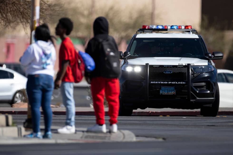 Police investigate a shooting at Western High School in Las Vegas, Tuesday, March 29, 2022. (Er ...