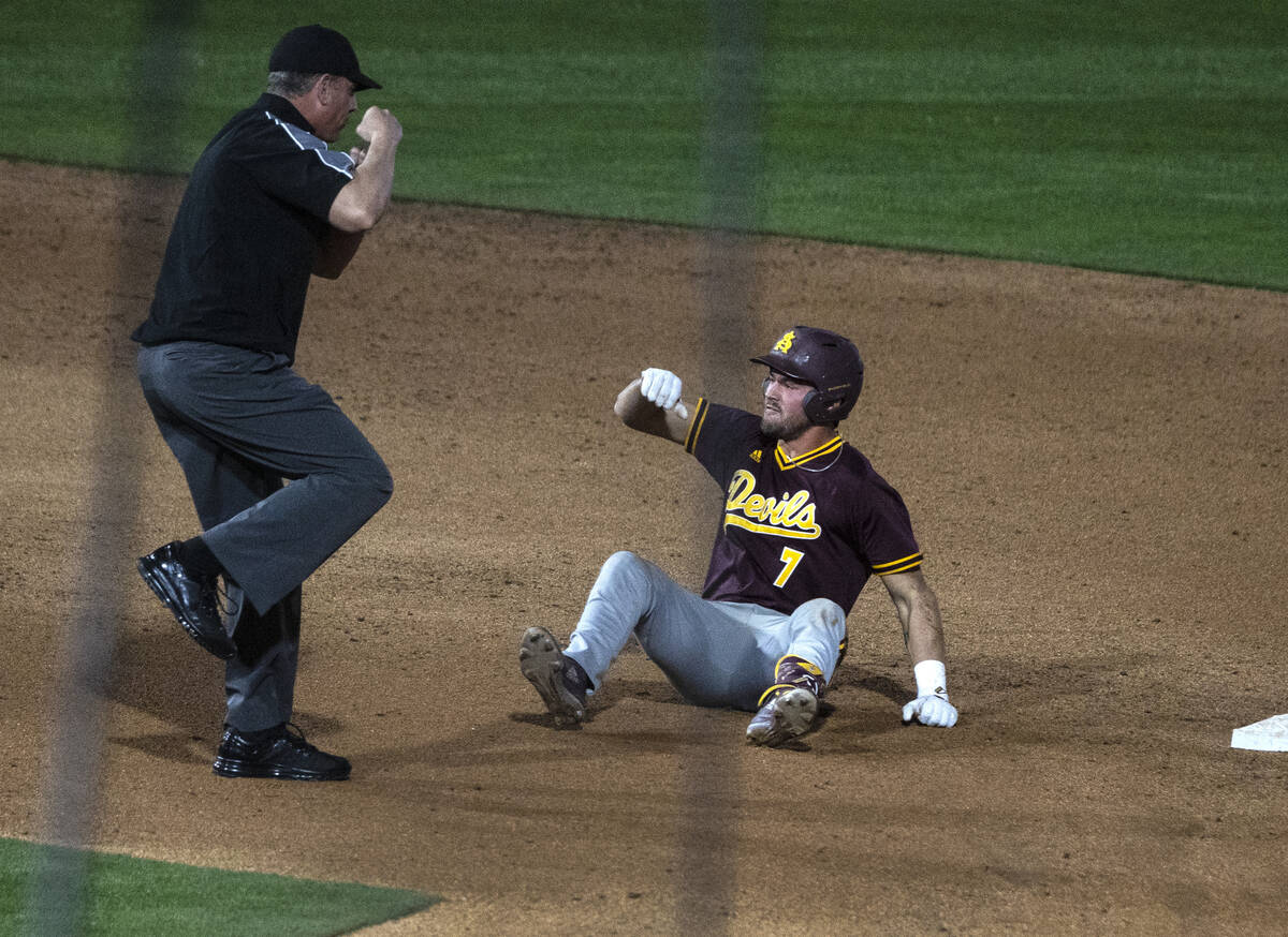 Arizona St. outfielder Conor Davis (7) protests the call after being tagged out at second durin ...