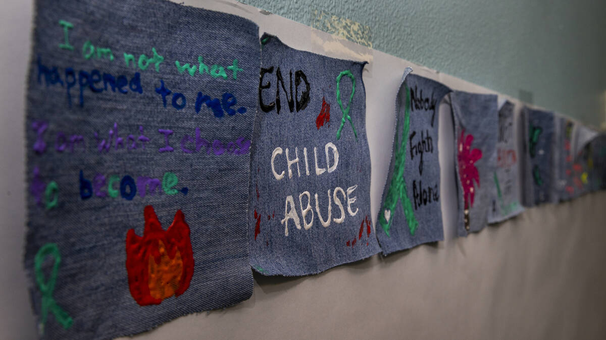 Painted fabric squares line the lobby of the Southern Nevada Children’s Advocacy Center withi ...