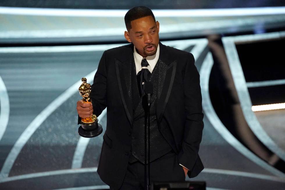 Will Smith cries as he accepts the award for best performance by an actor in a leading role for ...