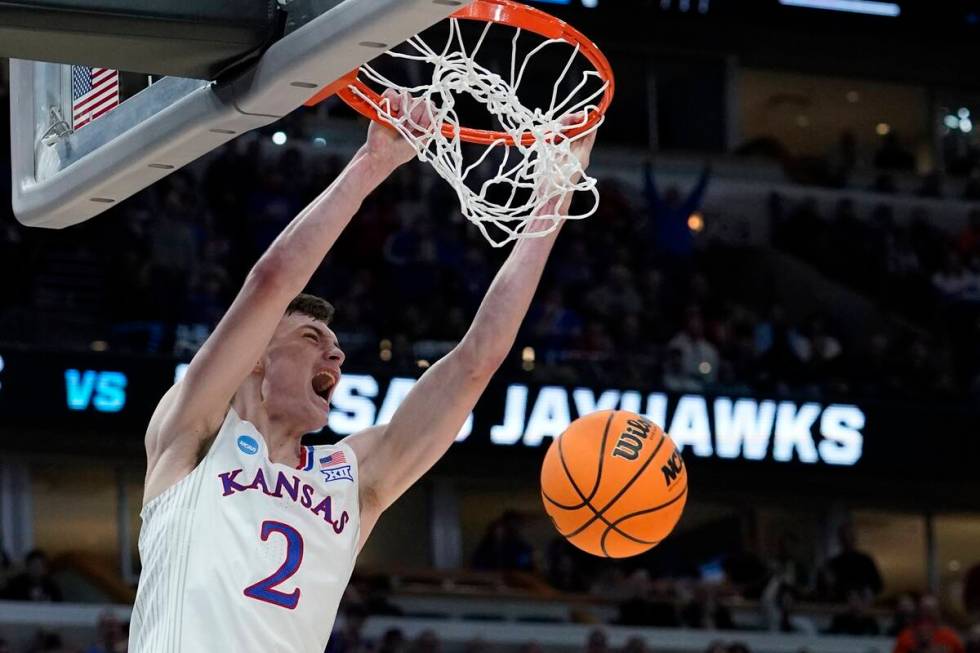 Kansas' Christian Braun dunks during the second half of a college basketball game in the Elite ...