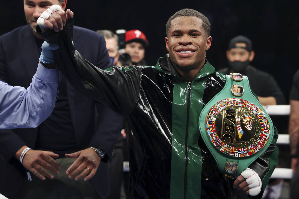 Devin Haney has his hand raises by referee Russell Mora after his win by unanimous decision aga ...