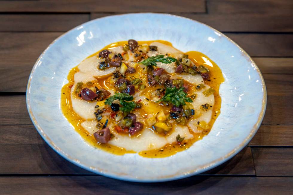 Chef Rob Moore prepares amberjack crudo at the Rosa Ristorante still under construction on Frid ...