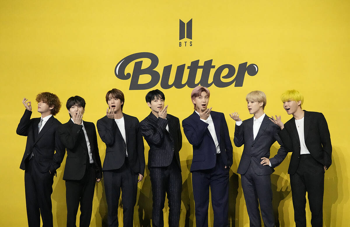 Members of South Korean K-pop band BTS, V, SUGA, JIN, Jung Kook, RM, Jimin, and j-hope from lef ...