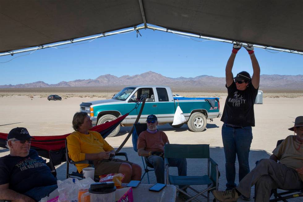 Joe Oden, left, Nils Meunch, Blake Learmonth and Renee Fields relax after a long day of landsai ...