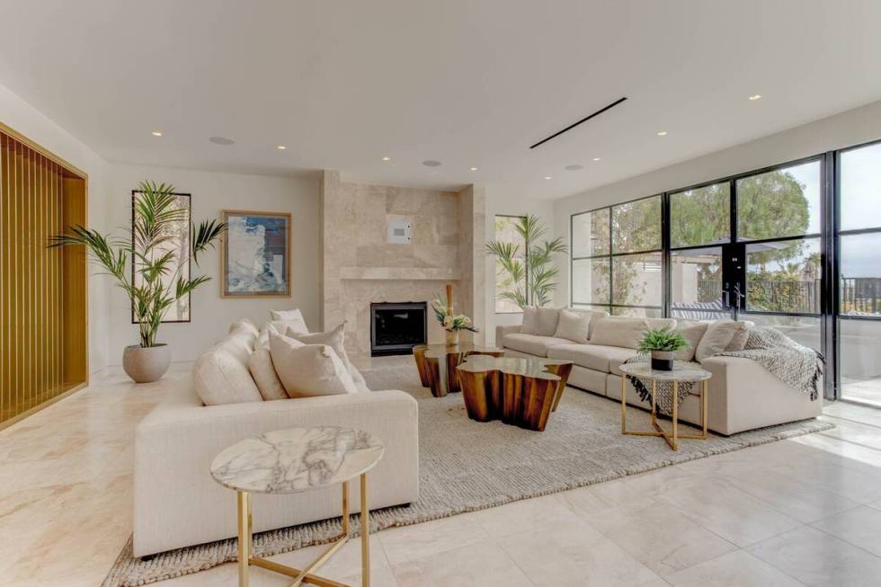 The living room opens onto the patio. (Signature Real Estate Group)