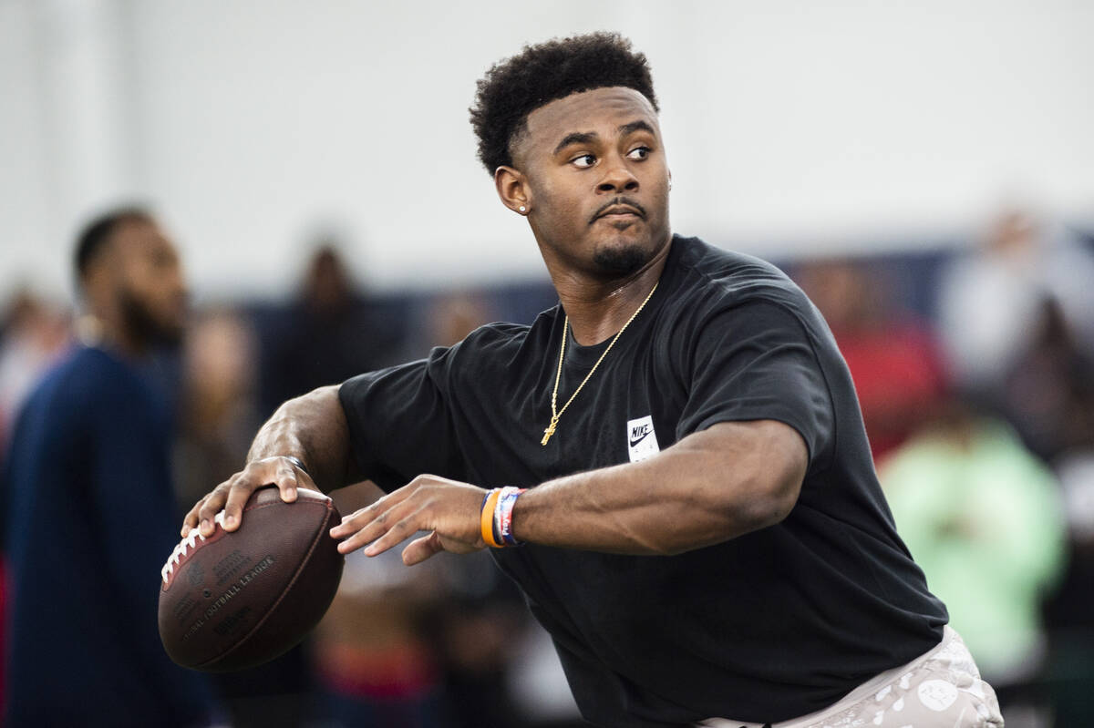 Liberty quarterback Malik Willis runs through passing drills during Liberty Football Pro Day in ...